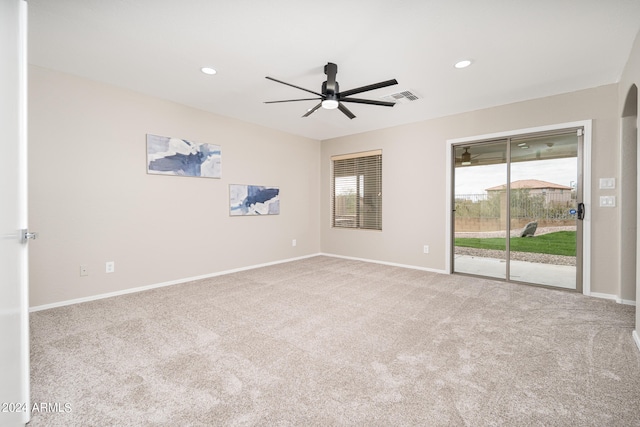 empty room with ceiling fan and light colored carpet