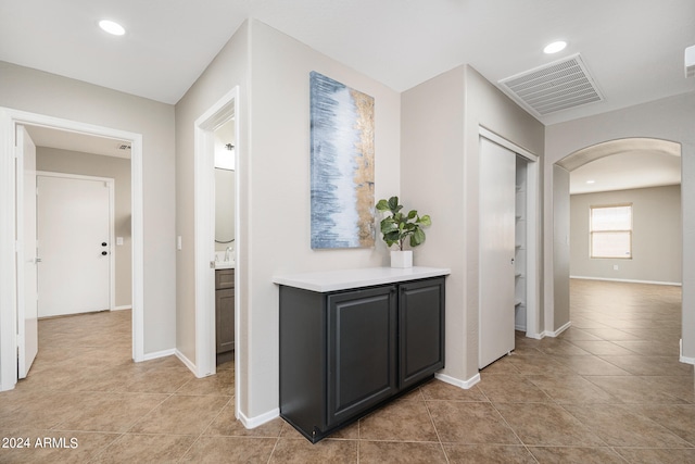 hall with light tile flooring