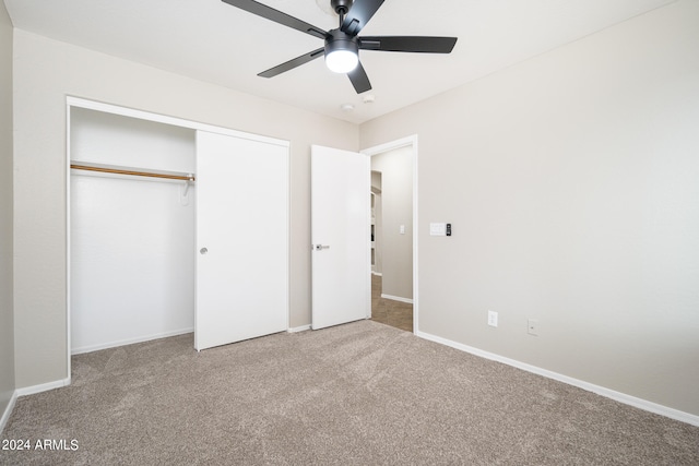 unfurnished bedroom with a closet, light carpet, and ceiling fan