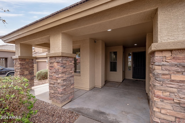 entrance to property featuring a garage