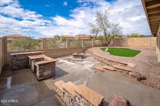 view of patio / terrace with a fire pit