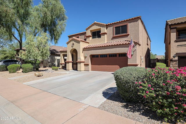 mediterranean / spanish house featuring a garage