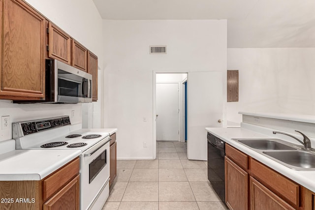 510 W Amoroso Dr, Gilbert, AZ 85233 - kitchen with white electric range, a sink, stainless steel microwave, dishwasher, and light countertops