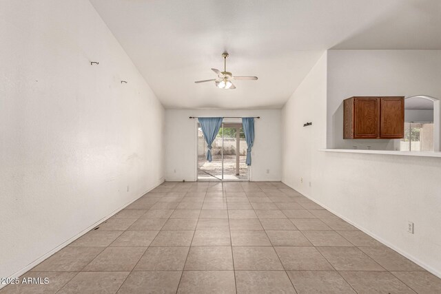 510 W Amoroso Dr, Gilbert, AZ 85233 - spare room featuring ceiling fan, light tile patterned floors, and baseboards