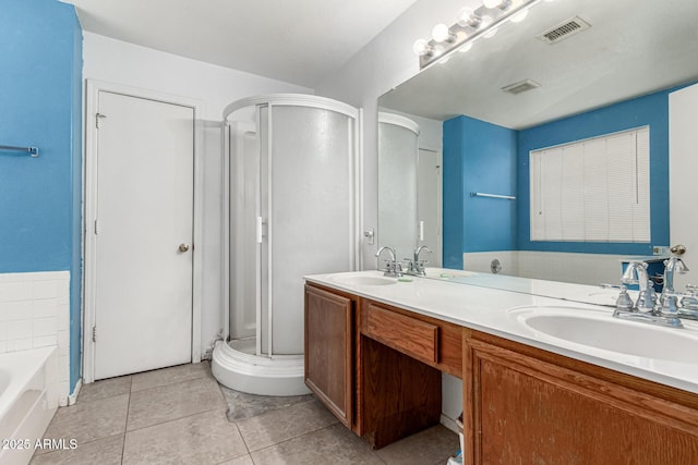 510 W Amoroso Dr, Gilbert, AZ 85233 - bathroom featuring a shower stall, double vanity, a bath, and tile patterned flooring