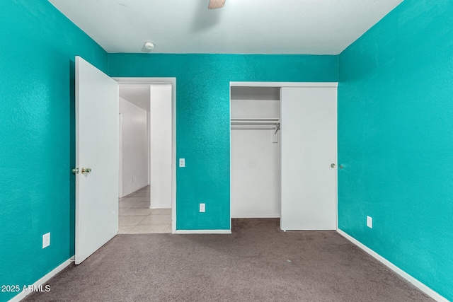 510 W Amoroso Dr, Gilbert, AZ 85233 - unfurnished bedroom featuring carpet, a closet, a ceiling fan, and a textured wall