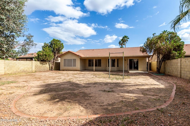 510 W Amoroso Dr, Gilbert, AZ 85233 - back of house with a tiled roof, a fenced backyard, stucco siding, and a patio