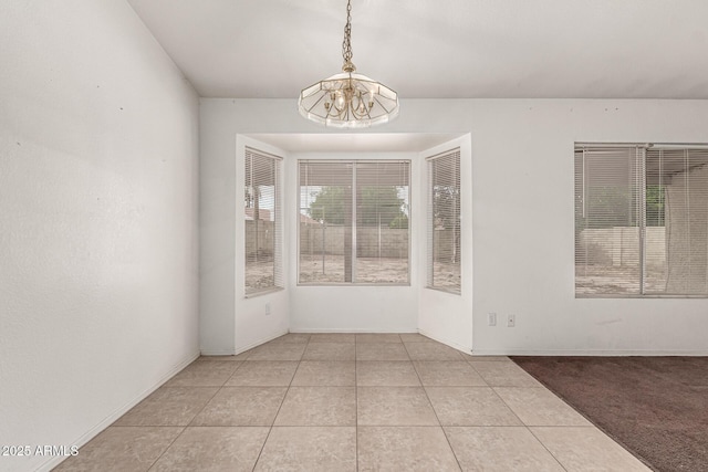 510 W Amoroso Dr, Gilbert, AZ 85233 - unfurnished dining area featuring light tile patterned flooring and a chandelier