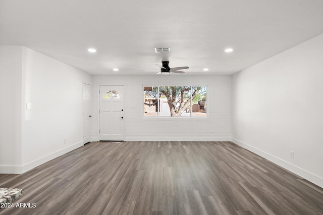 unfurnished living room with baseboards, visible vents, wood finished floors, and recessed lighting