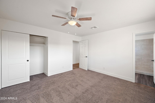 unfurnished bedroom with carpet, a closet, visible vents, and baseboards