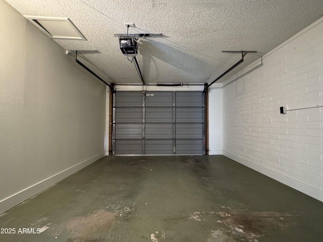 garage with a garage door opener and baseboards