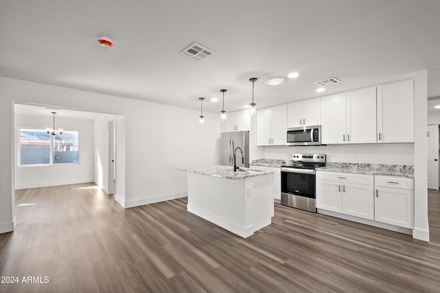 kitchen featuring appliances with stainless steel finishes, wood finished floors, visible vents, and white cabinetry