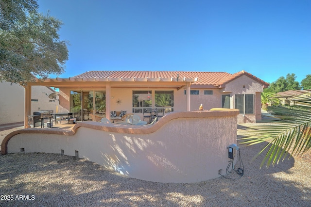 rear view of house featuring a patio