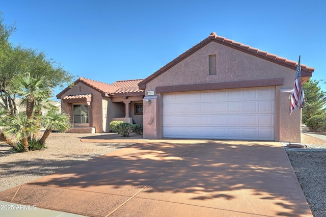 mediterranean / spanish-style home featuring a garage