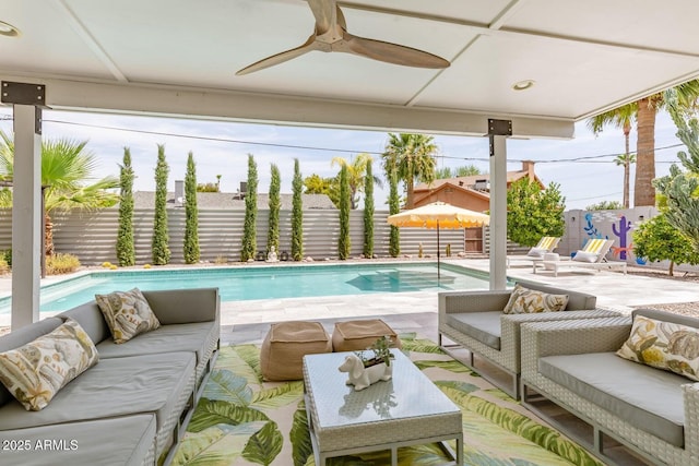 view of pool featuring a patio, a fenced in pool, an outdoor living space, a fenced backyard, and ceiling fan