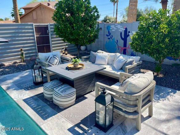 view of patio with an outdoor hangout area and a fenced backyard
