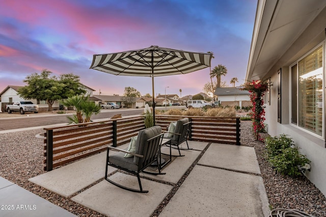 patio terrace at dusk with a residential view