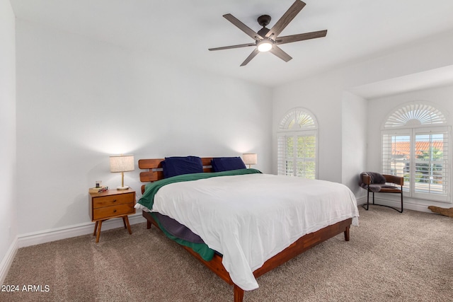 bedroom featuring a ceiling fan, carpet, and baseboards