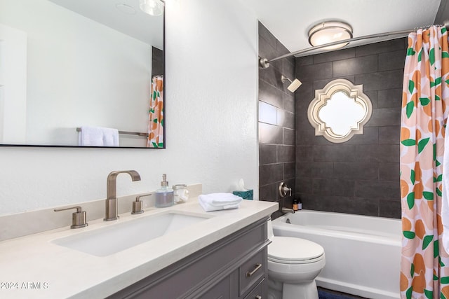 bathroom featuring toilet, shower / bath combination with curtain, and vanity