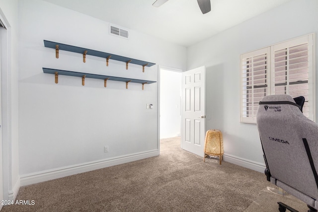 workout room with carpet, visible vents, ceiling fan, and baseboards