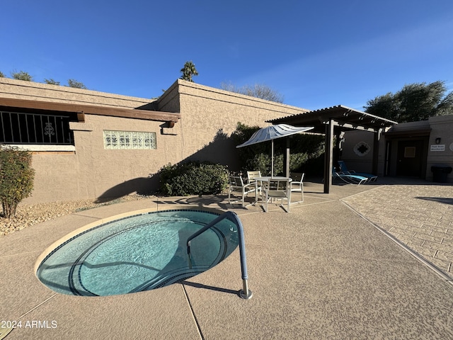 view of swimming pool featuring a patio and a pergola