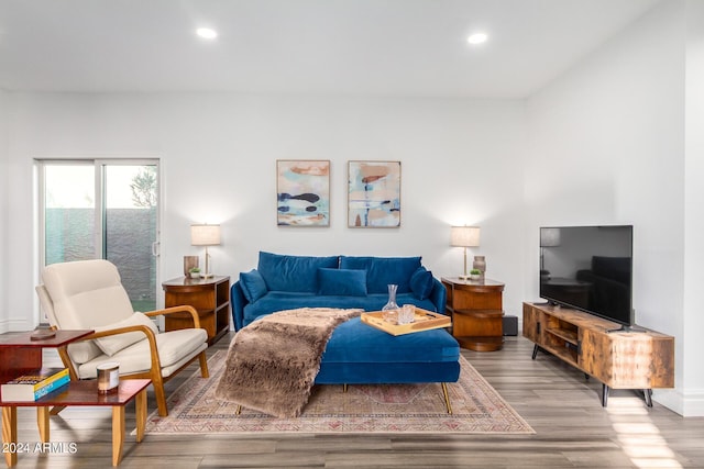 living room with recessed lighting and wood finished floors