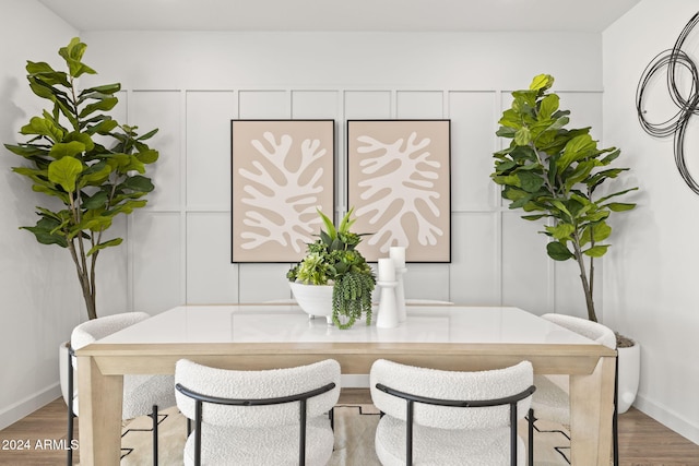 dining area with wood-type flooring