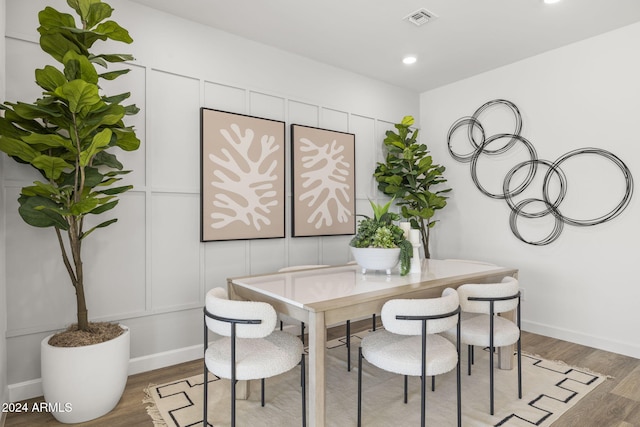 dining area featuring hardwood / wood-style floors