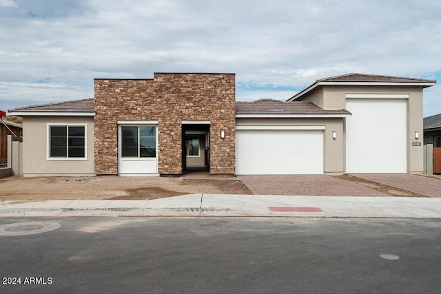 view of front of home with a garage