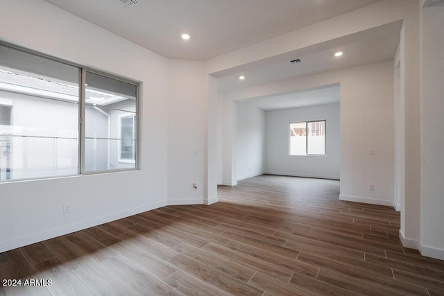 empty room with hardwood / wood-style floors