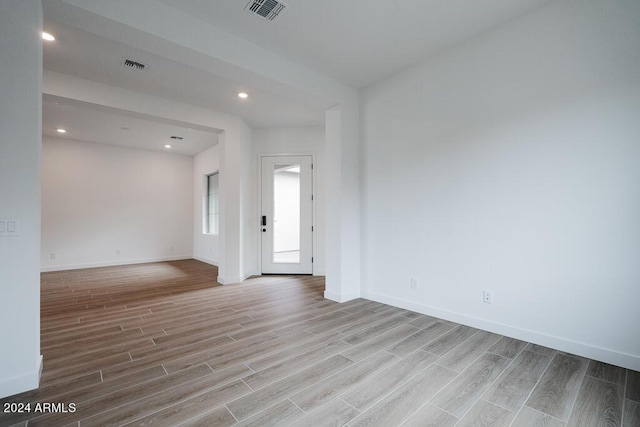 unfurnished room with light hardwood / wood-style flooring