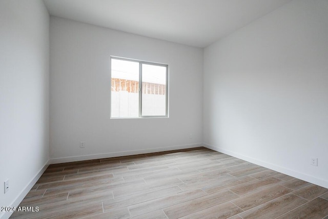 unfurnished room featuring light hardwood / wood-style floors