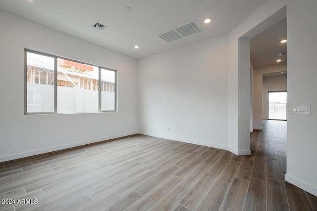 unfurnished room featuring light hardwood / wood-style flooring