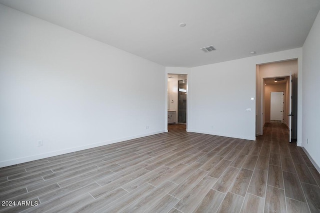 unfurnished bedroom with hardwood / wood-style flooring