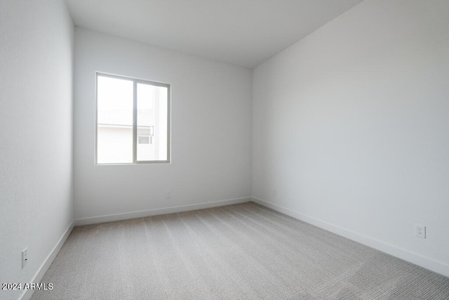 spare room featuring carpet flooring