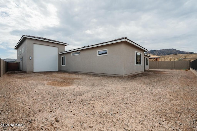 rear view of house with a mountain view