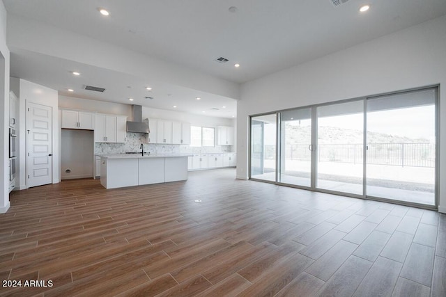 unfurnished living room featuring light hardwood / wood-style flooring