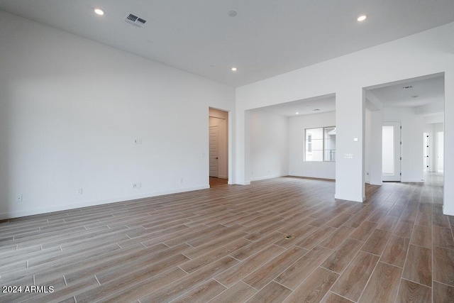 spare room featuring light wood-type flooring