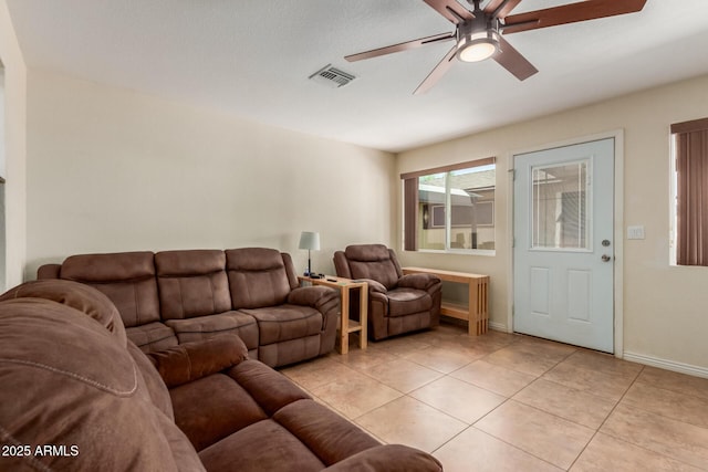 538 E Estevan Ave, Apache Junction, AZ 85119 - living area with ceiling fan and light tile patterned flooring