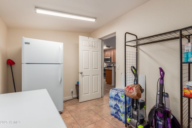 538 E Estevan Ave, Apache Junction, AZ 85119 - kitchen featuring stainless steel appliances, light tile patterned floors, and light countertops