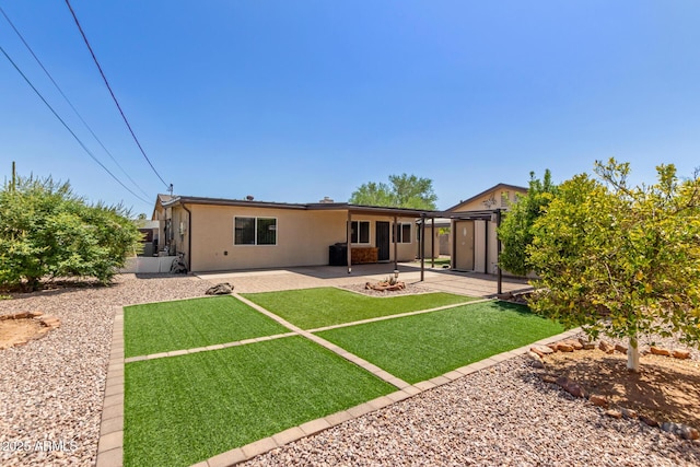 538 E Estevan Ave, Apache Junction, AZ 85119 - back of property with a patio, stucco siding, and a yard
