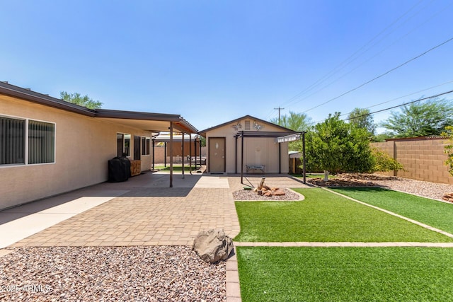 538 E Estevan Ave, Apache Junction, AZ 85119 - fenced backyard with a patio area and a storage shed