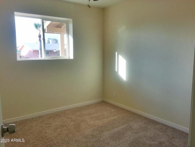 538 E Estevan Ave, Apache Junction, AZ 85119 - empty room with healthy amount of natural light, carpet floors, and a ceiling fan