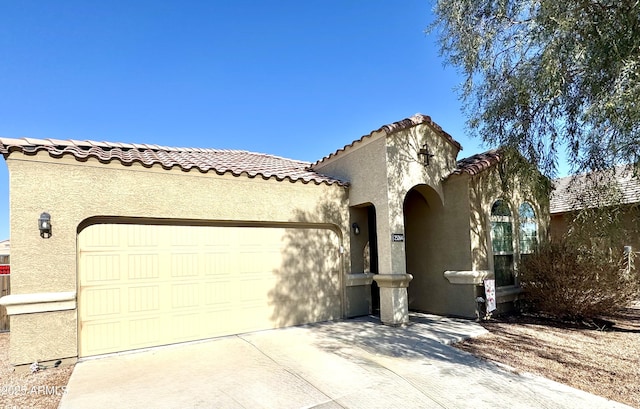 mediterranean / spanish-style home featuring a garage