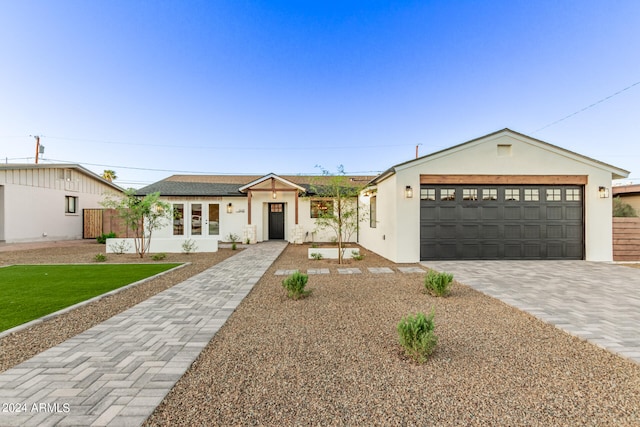 single story home with a garage