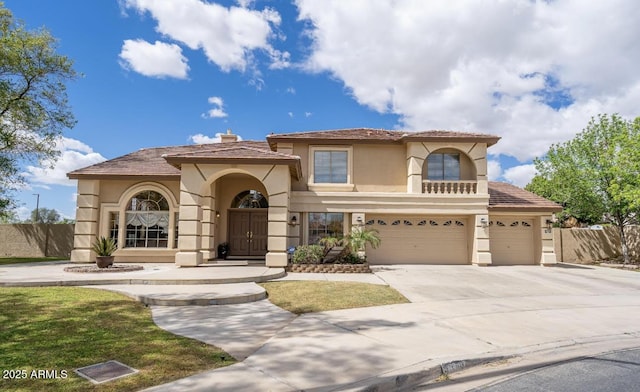 5510 N 132nd Dr, Litchfield Park, AZ 85340 - mediterranean / spanish house featuring stucco siding, fence, concrete driveway, and an attached garage