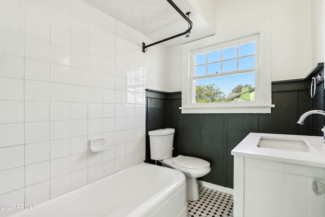 bathroom featuring toilet, shower / tub combination, and vanity