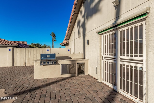 9169 W Ludlow Dr W, Peoria, AZ 85381 - view of patio / terrace with an outdoor kitchen, area for grilling, wine cooler, and fence
