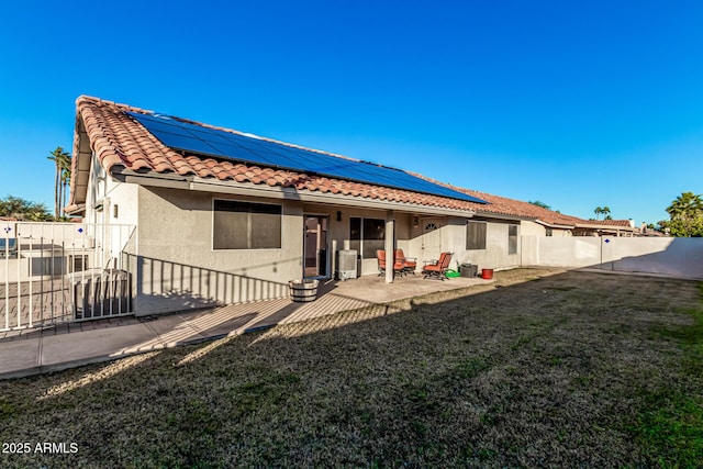 9169 W Ludlow Dr W, Peoria, AZ 85381 - back of property featuring a tile roof, stucco siding, a patio, a fenced backyard, and a yard