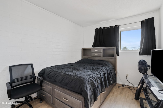 bedroom with light hardwood / wood-style floors